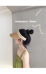 Stylish women straw sun visor hat with striped band, perfect for summer beach and outdoor travel.