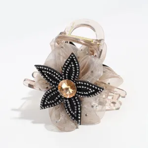 Close-up details of the elegant mesh flower hair claw clip with shiny rhinestones.