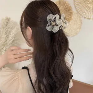 Elegant mesh flower hair claw clip with sparkly rhinestones for women hair styling accessories.