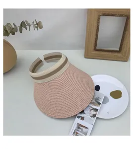 Pink straw sun visor hat with elastic striped band, perfect for summer outdoor UV protection.