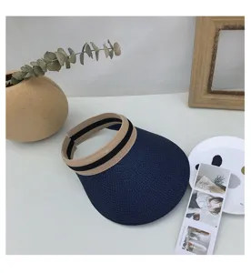 Woven sun visor detail view, stylish blue and beige empty top straw hat for women summer sun protection.