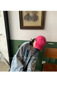 Women vintage washed pink baseball hat, casual denim cap style, trendy fashion streetwear.