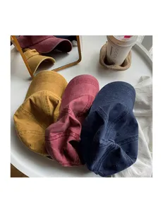 Washed solid color vintage baseball cap detail shot, soft top curved brim hat in multiple colors.