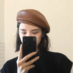 Detailed shot of brown PU leather beret, vintage painter hat style, daily wear accessory.