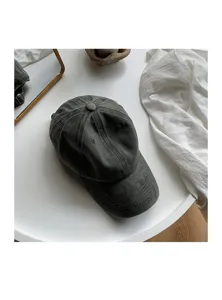 Close-up view of the dark grey washed cotton baseball cap, showing the soft top and curved brim.