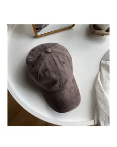 Vintage washed solid color baseball cap for women, soft top curved brim hat, casual retro style.