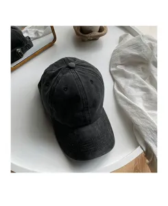 Retro washed black cotton baseball cap, casual soft top curved brim dad hat for daily wear.