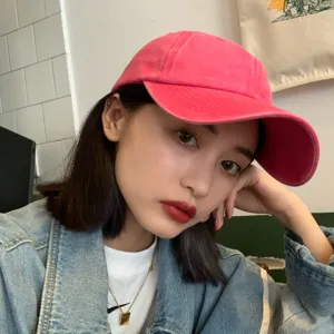 Washed pink baseball cap for women, vintage solid color curved brim casual sun hat.