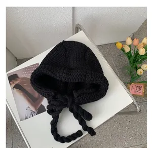 Black knitted balaclava hat with braided ties, warm winter ear-flap beanie for women.