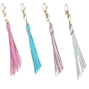 Detailed view of colorful PU leather tassel keychains with gold lobster clasps in 4 colors.