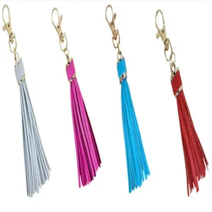Detailed view of colorful PU leather tassels with metal clasps for DIY bag accessories.