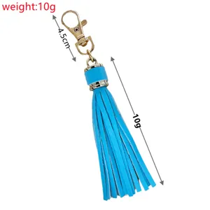Blue PU leather tassel keychain with gold lobster clasp, lightweight stylish bag accessory.