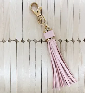 Pink PU leather tassel keychain with gold clasp for DIY bags and accessories detailing view