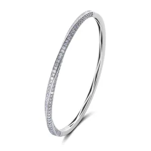 Close-up detail of silver twisted Mobius strip pave diamond bangle bracelet sparkle.
