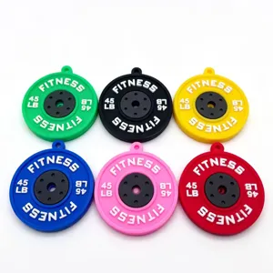 Detailed view of colorful miniature barbell plate keychain accessories for fitness lovers.