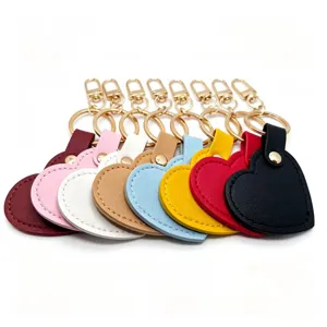 Colorful heart leather keychain detail showcasing vibrant multi-color options and gold hardware.