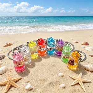 Detailed shot of colorful mini drift bottle keychains with tiny shells and clear liquid.