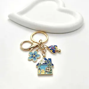 Süßer blauer Haus Blume Pilz Schlüsselanhänger aus Legierung, idealer Tasche und Auto Schlüsselanhänger.
