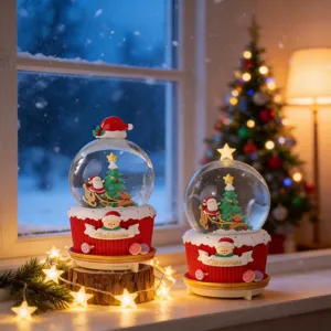 Two creative luminous Santa Claus Christmas snow globes featuring warm festive lights