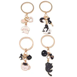Set of four cute enamel cat and dog keychains with golden heart and moon charms
