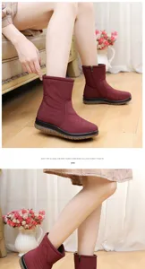 Detail view of wine red waterproof snow boots with fleece lining and feather embroidery.