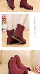 Detailed view of burgundy waterproof snow boots with quilted texture and side zipper