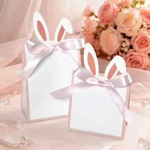 Kreative rosa-weiße Hasenohr-Geschenktüten mit Seidenbändern für Osterparty-Geschenke