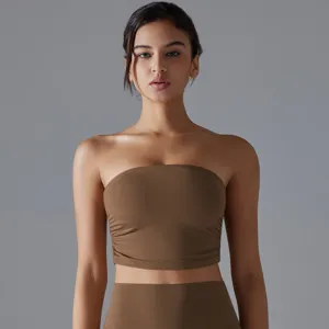 Detailed shot of a brown ruched bandeau yoga sports bra with breathable fabric
