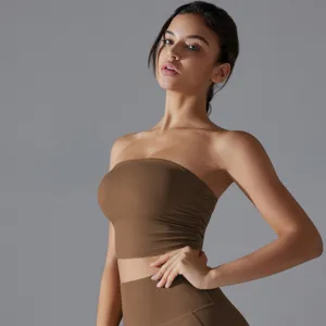 Detailed macro view of brown ruched strapless yoga tube top and matching leggings.