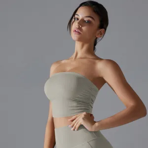 Close-up detail of a sage green ruched strapless yoga tube top for gym fitness