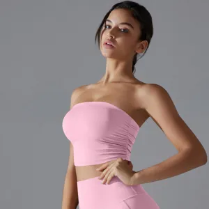 Close-up of pink ruched tube top yoga bra showing side pleated details and fit.
