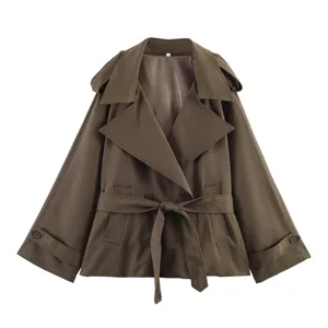 Detailed view of stylish brown loose trench coat with wide lapel and belted waist