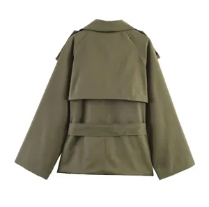 Detail view of an olive green women's trench coat featuring a back flap and belt.