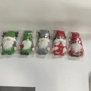 Set de cinco gnomos navideños festivos de peluche con gorros puntiagudos y barbas blancas