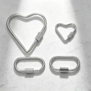 High-quality stainless steel heart and oval carabiner connectors for DIY jewelry making.