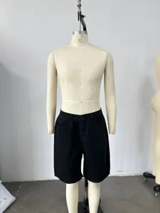 Front view of black denim shorts on a mannequin