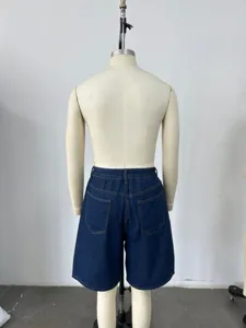Back view of men's loose dark blue denim shorts featuring functional rear pockets