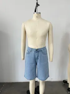 Detail view of men's loose fit light blue denim shorts on tailor mannequin