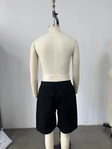 Back view of men's loose black denim shorts on mannequin showing rear pockets and stitching