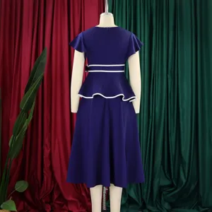 Rear view detail of a navy blue midi dress with white piping details on a mannequin.