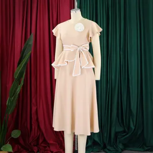 Elegant apricot midi dress with ruffle sleeves and white bow belt on mannequin.