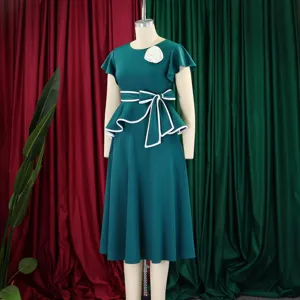 Elegant dark green short-sleeve peplum dress with white bow belt and floral brooch detail