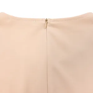 Close-up showing the smooth invisible back zipper and neckline on a beige slim mid-length dress