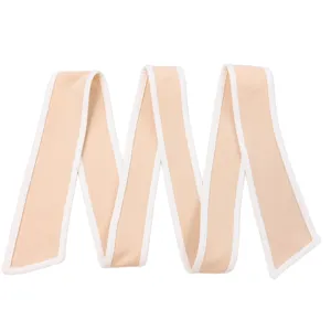 Detail of beige fabric waist tie with white piping for women's summer dress accessory