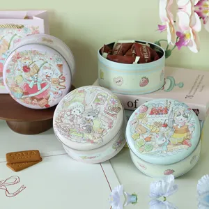 Scatole rotonde in latta goffrata con dolci illustrazioni di cartoni animati per biscotti