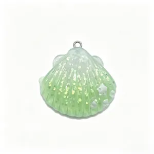 Green resin shell DIY charm with glitter detail, perfect for keychains, hair clips and bags.