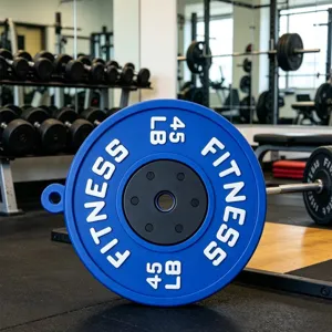 Close up detail of blue barbell plate pendant keychain for sports and gym bag decoration items.