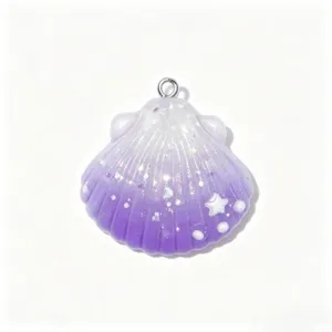 Close-up of a gradient purple resin seashell charm with glitters and pearl details, perfect DIY.