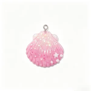 Detailed close-up of a pink gradient resin shell charm with glitter, star and pearl accents.