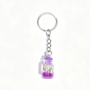 Detail view of a creative ocean theme shell drift bottle keychain with purple bottle.